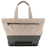 Space-saving foldable tote bag with waterproof main compartment and internal storage features