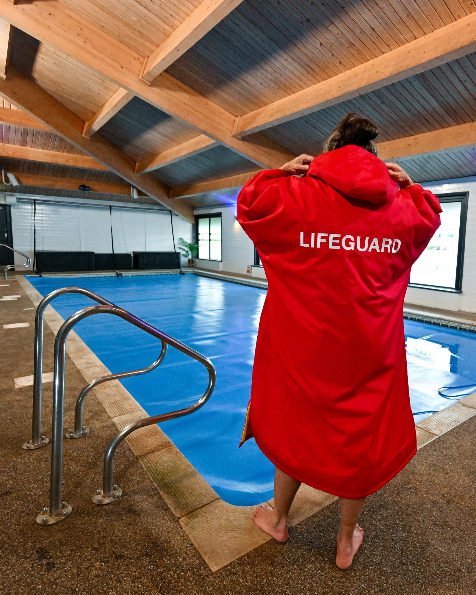 Quick warm red lifeguard at lake