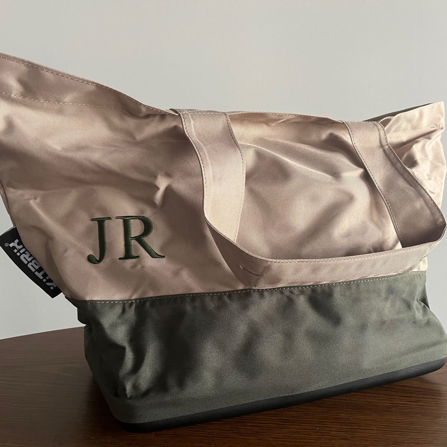 Tote bag with 'JR' monogram on a Tote bag surface