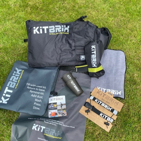 Outdoor kit bundle including foldable backpack, cups, seat mat and towel