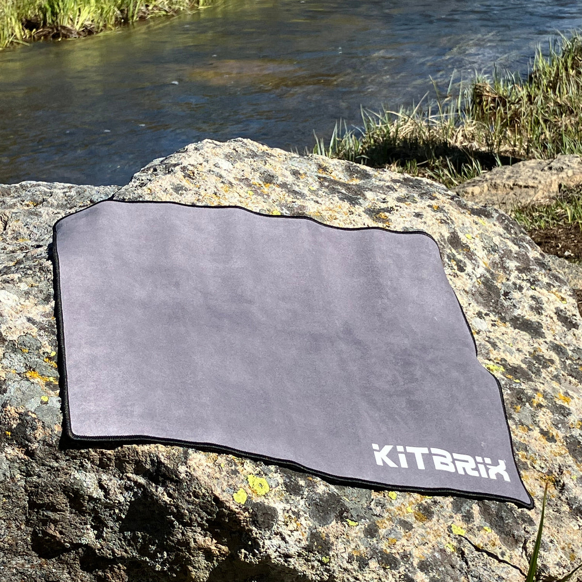 Waterproof base seat mat is sitting on the stone.