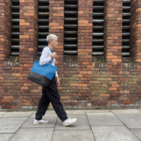 Carrying the tote walking on street