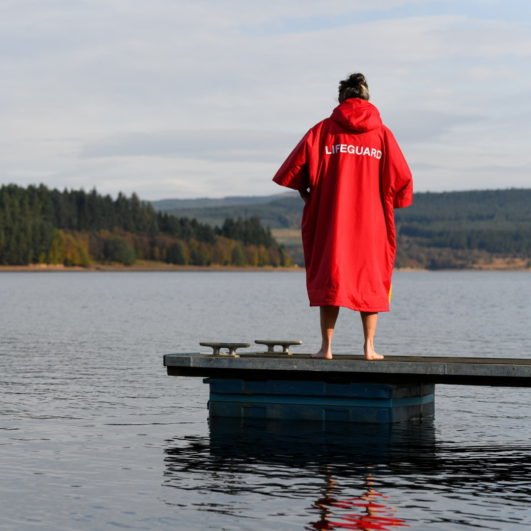 Quick warm red lifeguard at lake