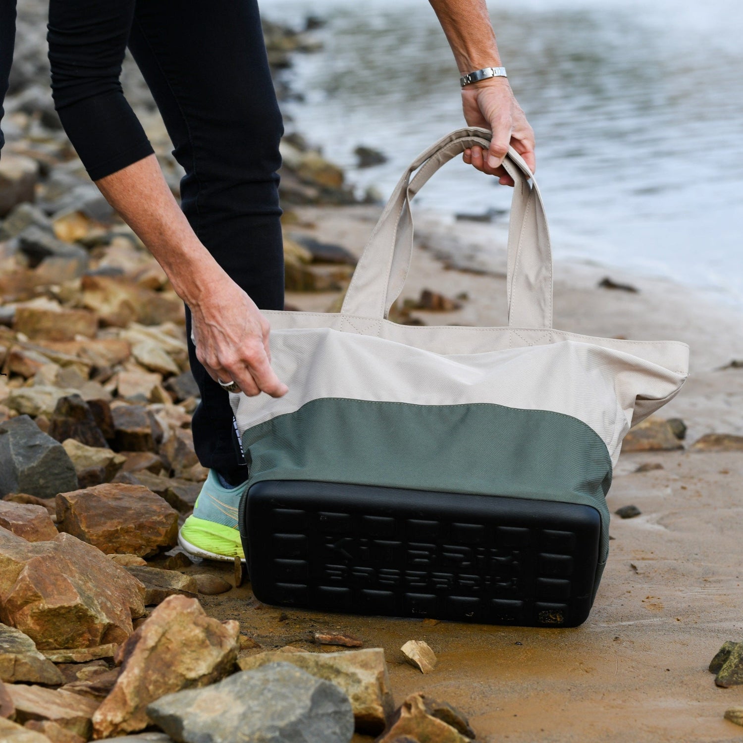 Eco-conscious tote bag made from robust 600D polyester fabric, featuring a waterproof moulded base
