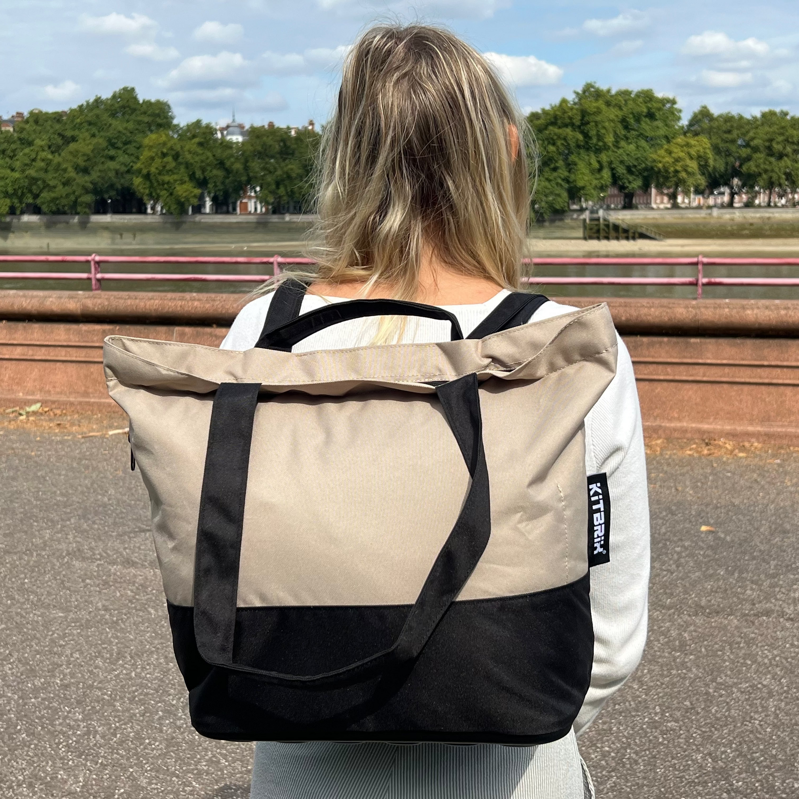 A_Girl_with_black_and_beige_TotePack_standing_on_the_roadside