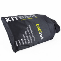 DobiPak being easily carried to the washing machine, demonstrating its convenience for transporting wet items.