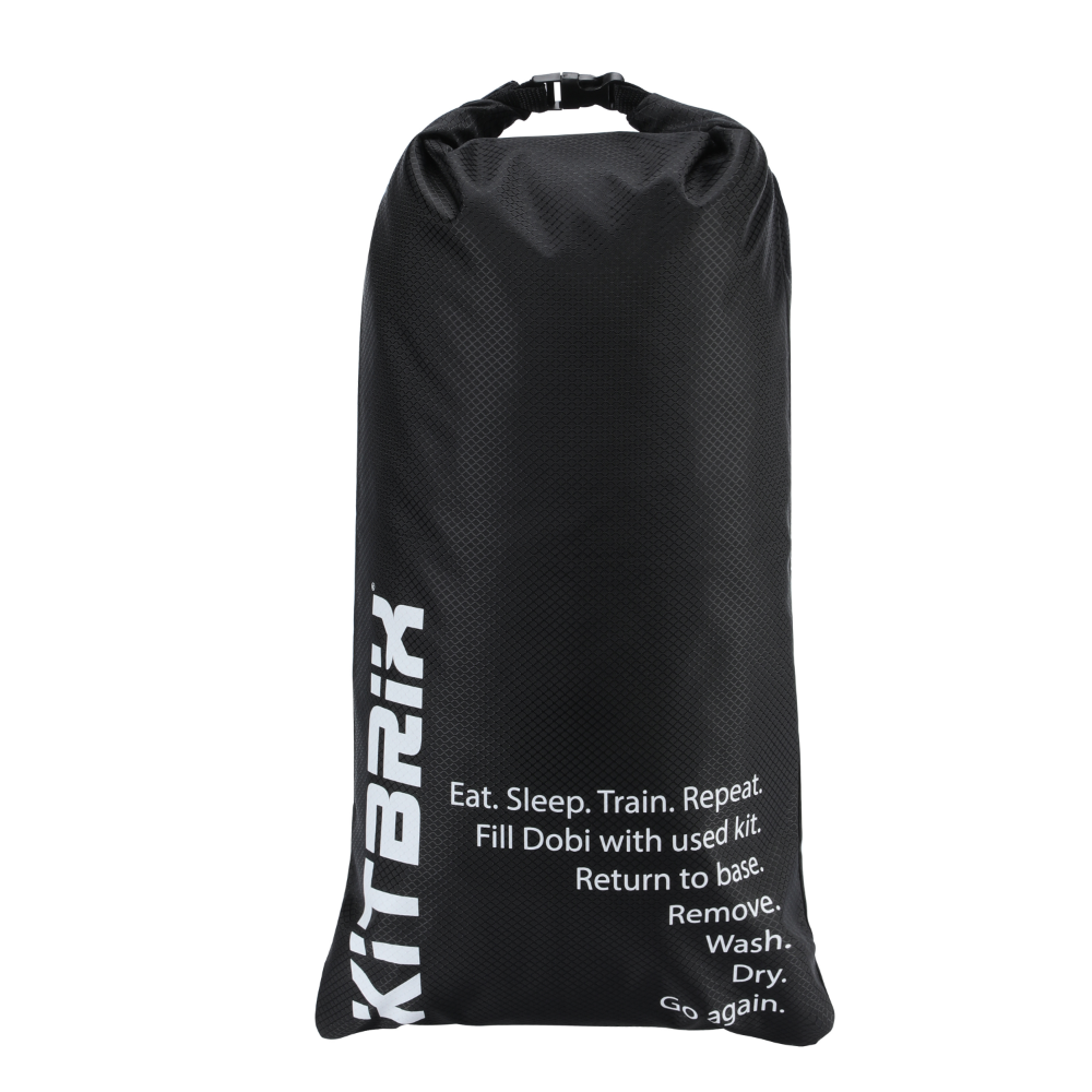 Dobi dry bag wet kit separator in use with muddy trainers and wet kit.